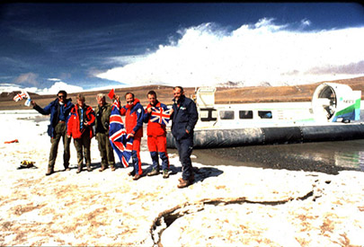 Hovercraft exepedition team standing at the source of the River Yangtze with hovercraft behind